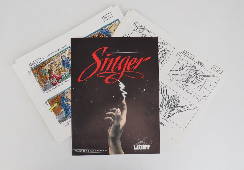 Proposed storyboards in color and black and white along with red and black poster for 1988 The Singer Motion Picture project.